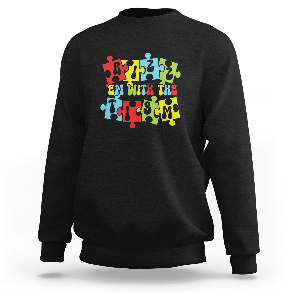 Black crewneck sweatshirt with colorful puzzle-style graphic across the chest