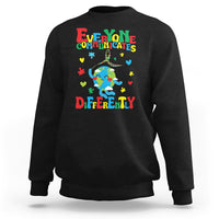 Black crewneck sweatshirt with colorful autism awareness text and puzzle graphic