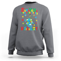 Charcoal gray crewneck sweatshirt with colorful autism awareness text and puzzle graphic