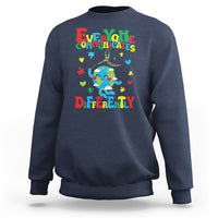 Navy crewneck sweatshirt with colorful autism awareness text and puzzle graphic