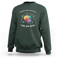 Dark forest green autism awareness sweatshirt with colorful brain graphic and slogan on chest