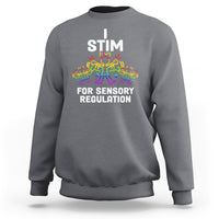 Charcoal gray crewneck sweatshirt with 'I STIM' and 'FOR SENSORY REGULATION' colorful graphic