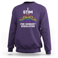 Purple crewneck sweatshirt with 'I STIM' and 'FOR SENSORY REGULATION' colorful graphic
