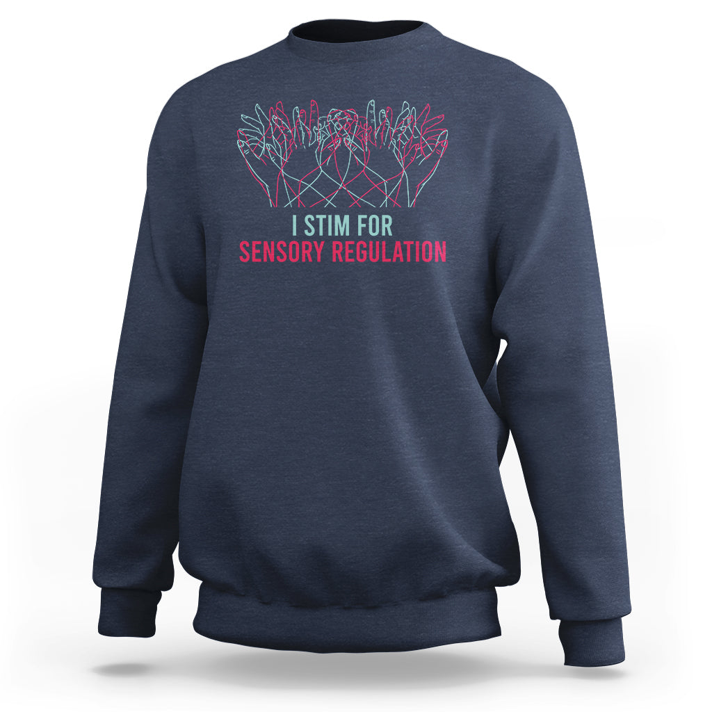 Navy crewneck sweatshirt with colorful hand graphic and “I STIM FOR SENSORY REGULATION”.