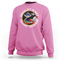 Azalea pink crewneck sweatshirt with colorful rainbow planet graphic and “Equality is no Rocket Science” text
