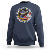 Navy crewneck sweatshirt with colorful rainbow planet graphic and “Equality is no Rocket Science” text