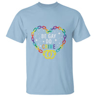 Light blue T-shirt with 'BE GAY DO CRIME' rainbow chain heart and handcuffs graphic