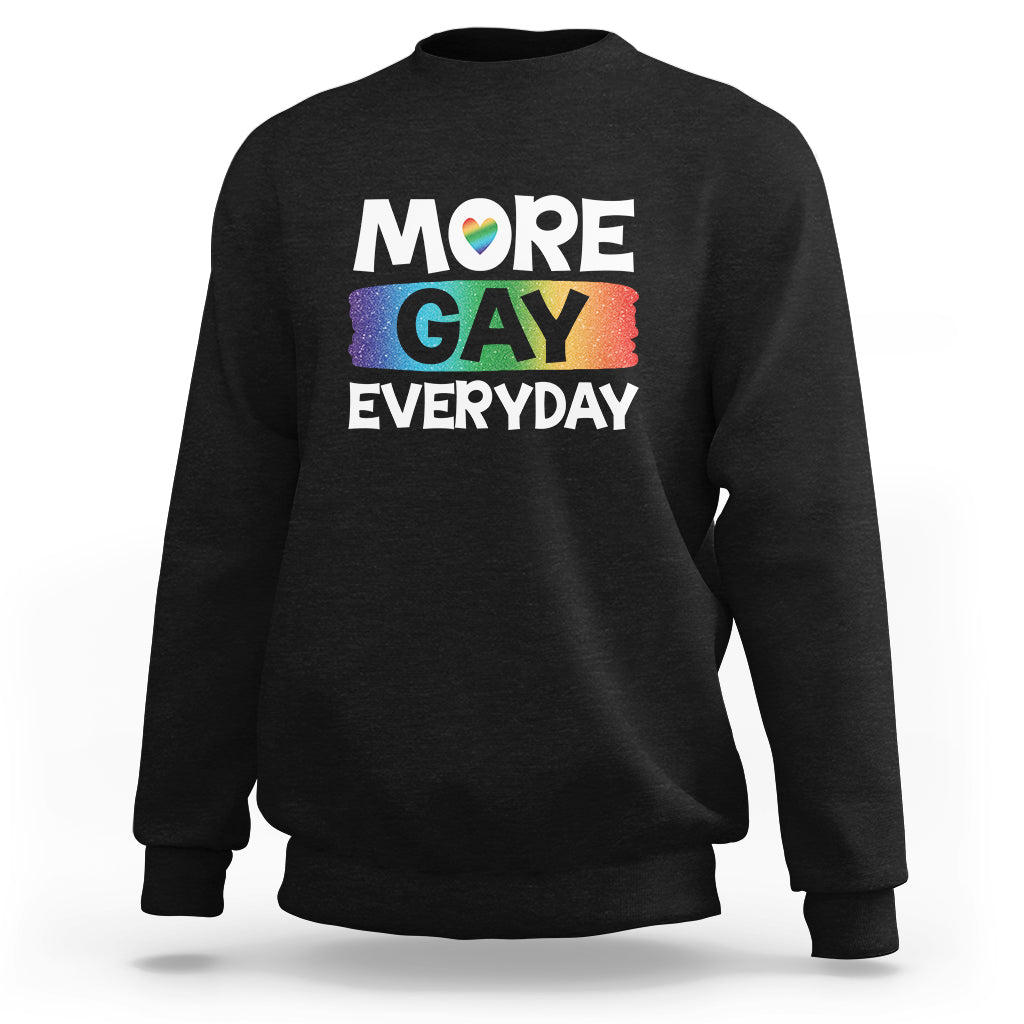 Black sweatshirt with “MORE GAY EVERYDAY” pride graphic on the front.