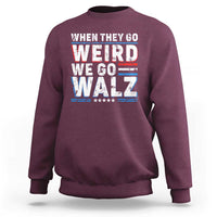 Maroon crewneck sweatshirt with bold 'WHEN THEY GO WEIRD WE GO WALZ' graphic