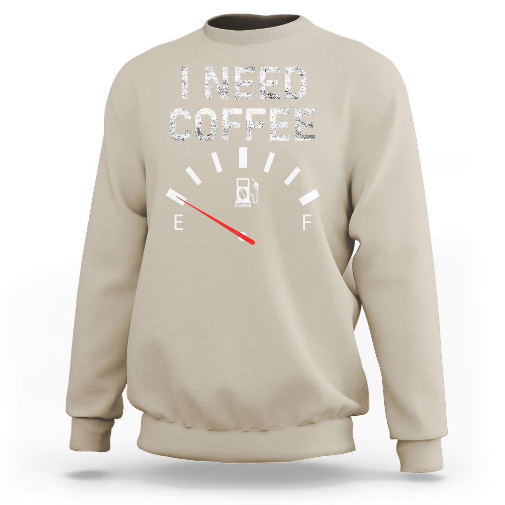 Sand crewneck sweatshirt with 'I NEED COFFEE' coffee meter graphic and long sleeves