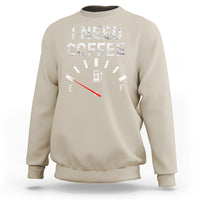 Sand crewneck sweatshirt with 'I NEED COFFEE' coffee meter graphic and long sleeves