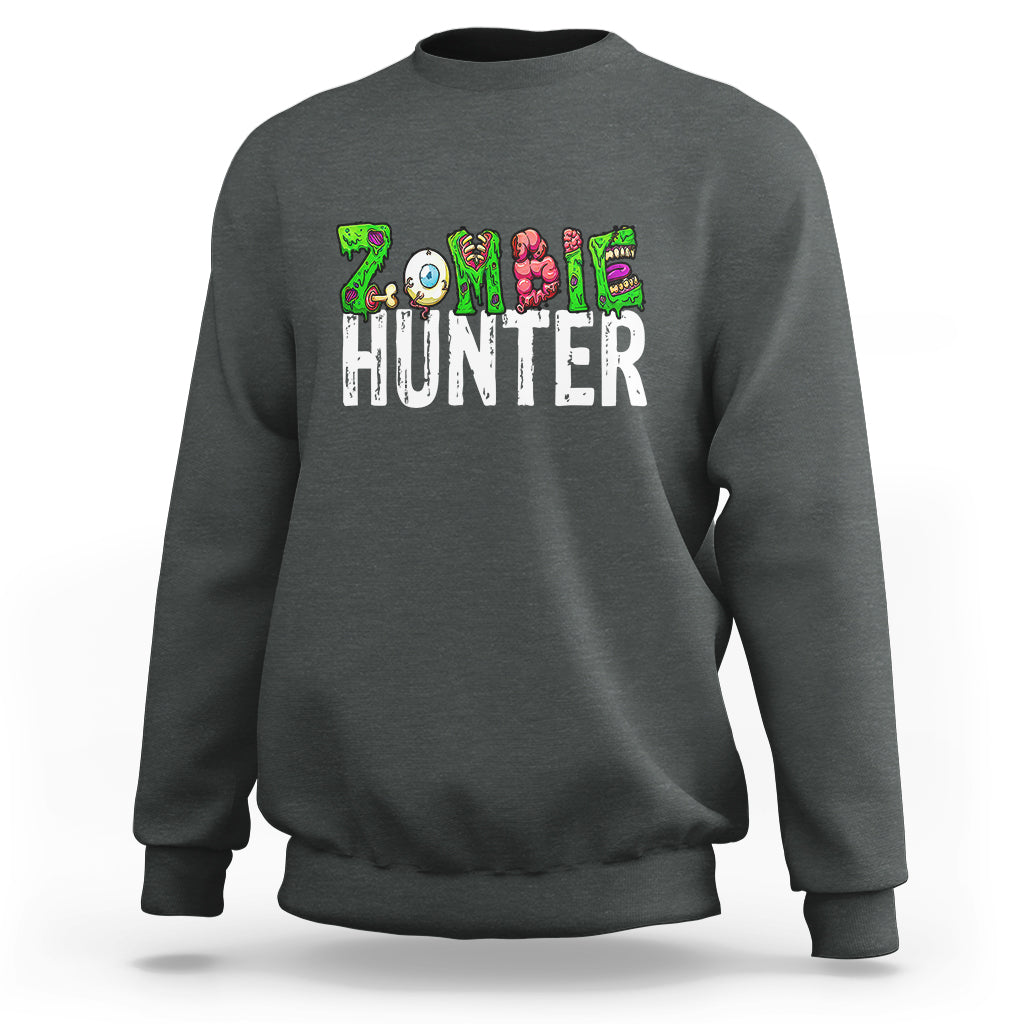 Dark heather Halloween sweatshirt with colorful zombie-eyed hunter graphic across chest