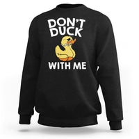 Black sweatshirt with front text “DON’T DUCK” and “WITH ME” plus yellow rubber duck graphic