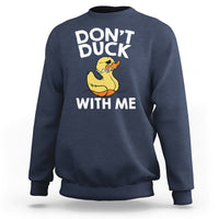 Navy sweatshirt with “DON’T DUCK” and “WITH ME” text and a yellow rubber duck graphic