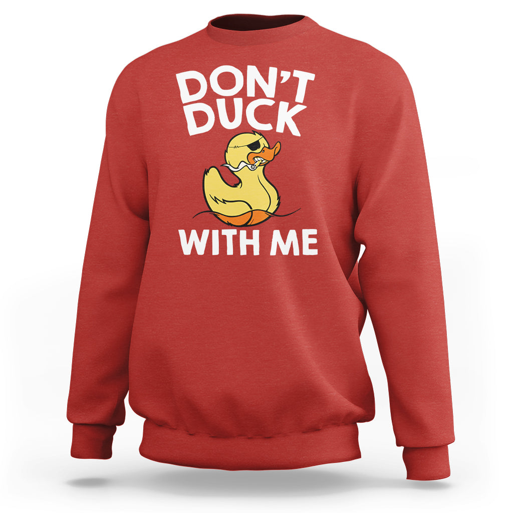 Red sweatshirt with front “DON’T DUCK” and “WITH ME” text and yellow rubber duck graphic