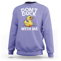 Lavender sweatshirt featuring “DON’T DUCK” and “WITH ME” text with a yellow rubber duck