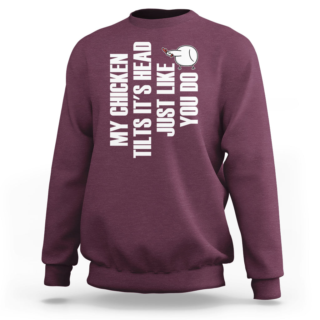 Maroon crewneck sweatshirt with chicken graphic and vertical text print