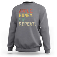 Rosh Hashanah sweatshirt in charcoal with “APPLE HONEY DIP REPEAT” graphic