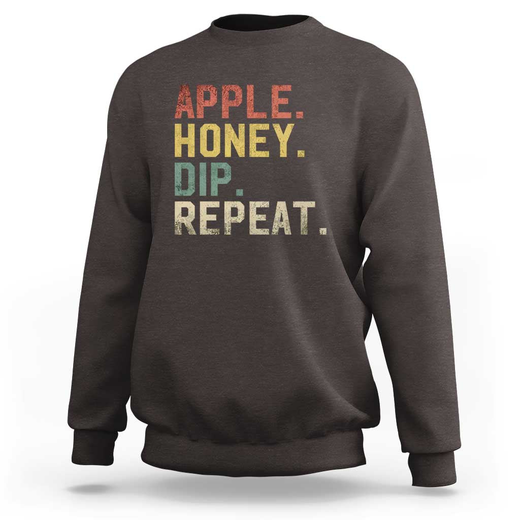 Rosh Hashanah sweatshirt in dark chocolate with “APPLE HONEY DIP REPEAT” graphic