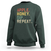 Rosh Hashanah sweatshirt in dark forest green with “APPLE HONEY DIP REPEAT” graphic