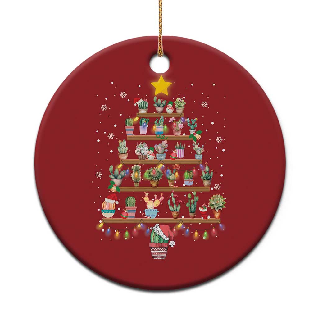 Red round Christmas ornament with illustrated tree stacked gifts and glowing star