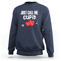 Navy crewneck sweatshirt with “JUST CALL ME CUPID” text and red heart-arrow graphic