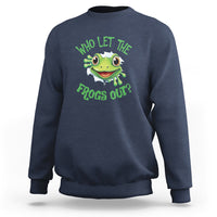 Navy sweatshirt with green frog graphic and text “Who Let The Frogs Out?”
