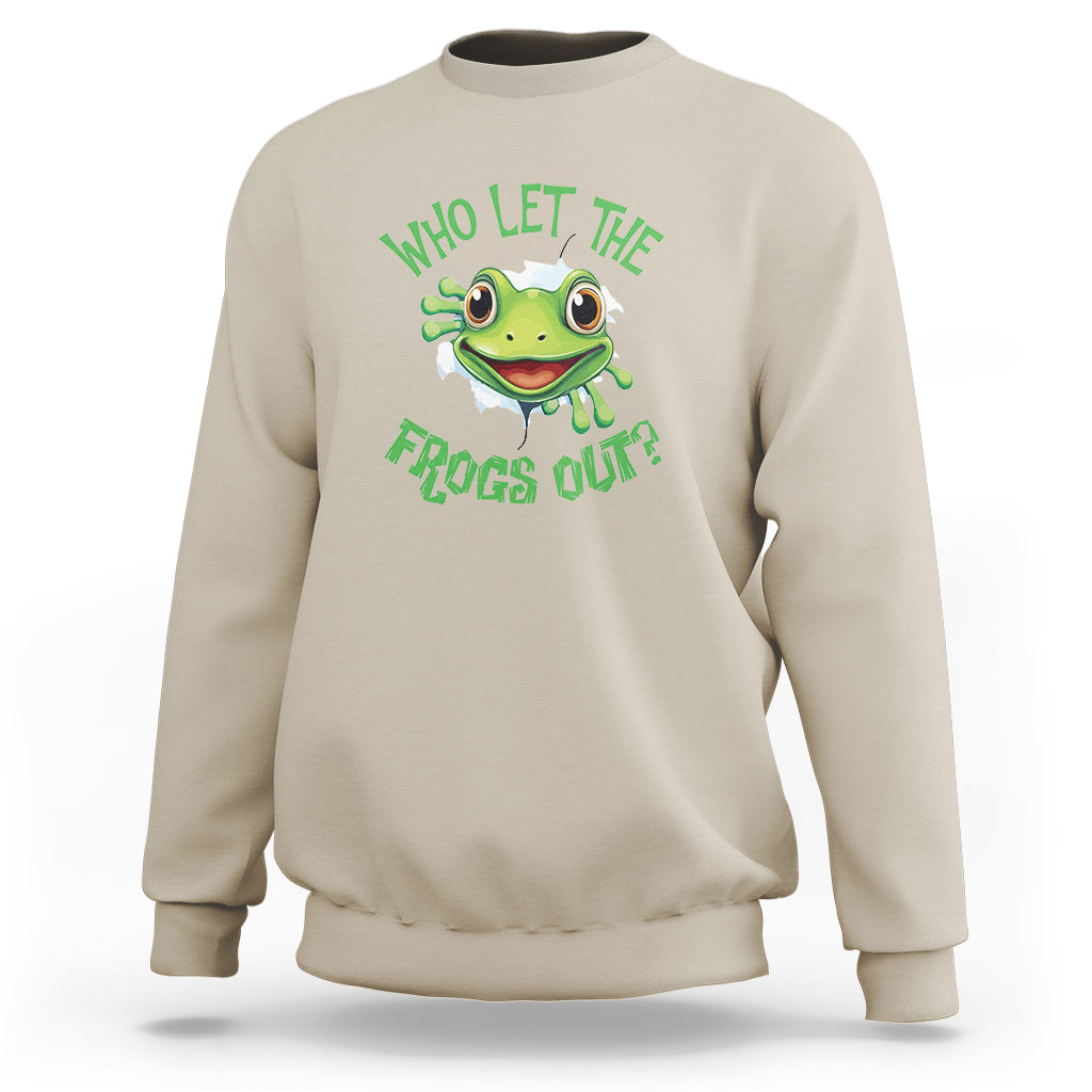 Sand/beige sweatshirt with green frog graphic and text “Who Let The Frogs Out?”