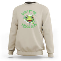 Sand/beige sweatshirt with green frog graphic and text “Who Let The Frogs Out?”