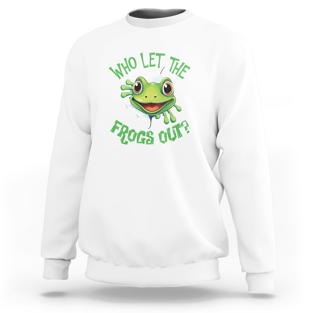 White sweatshirt with green frog graphic and text “Who Let The Frogs Out?”