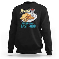 Black sweatshirt with chest graphic of matzah, cup, and “THE ORIGINAL FAST FOOD” text.