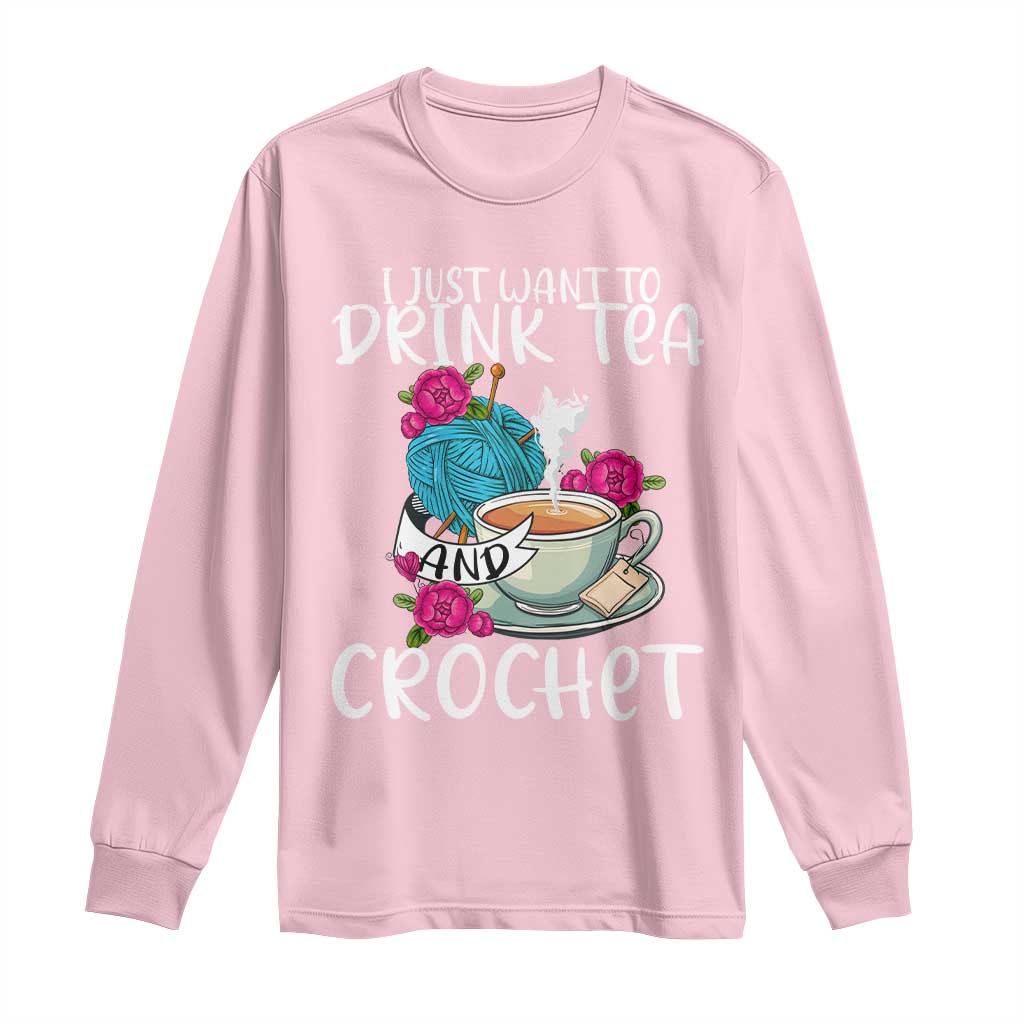 Light pink long-sleeve shirt with front graphic "Drink Tea" and "Crochet"
