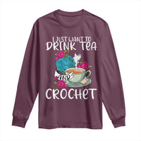 Maroon long-sleeve shirt with front graphic "Drink Tea" and "Crochet"