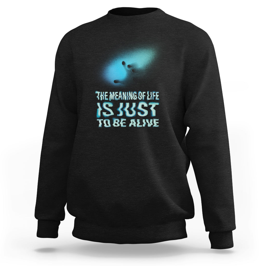 Black sweatshirt with turquoise glitch-style motivational text graphic on chest