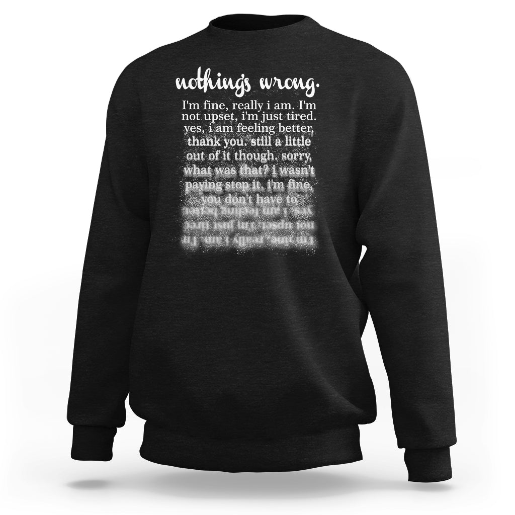 Black mental health sweatshirt with front text graphic reading "nothing's wrong"