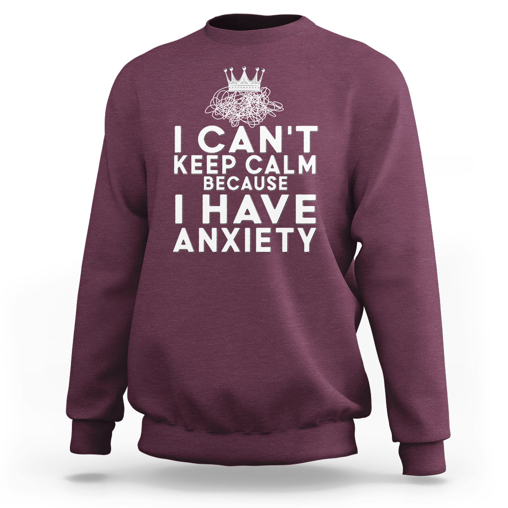 Maroon sweatshirt with white anxiety quote graphic and crown emblem