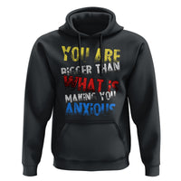 Black hoodie with front graphic, drawstring hood, and kangaroo pocket