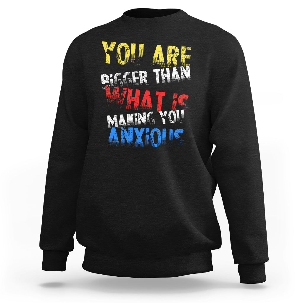 Black crewneck sweatshirt with colorful front slogan graphic