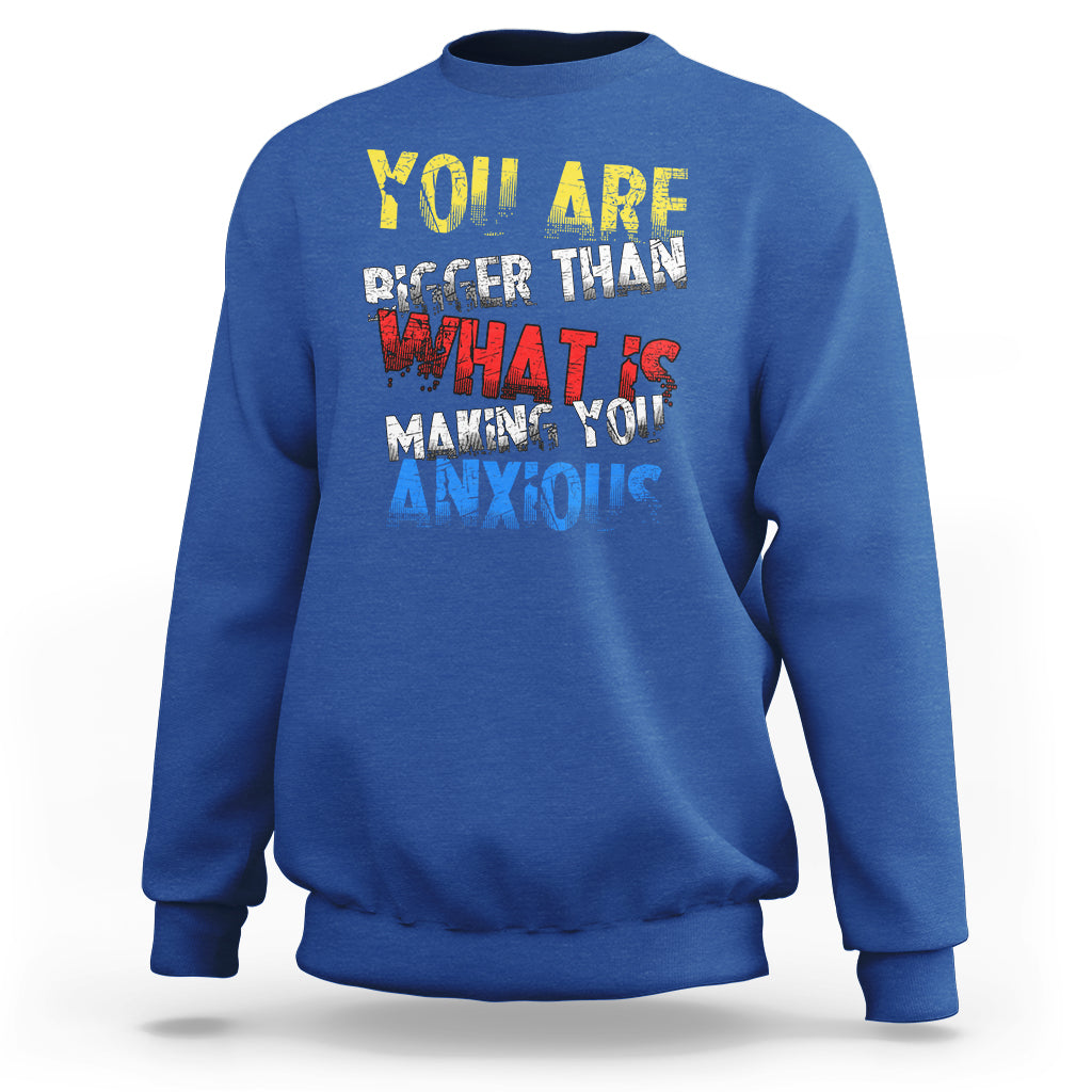 Royal blue crewneck sweatshirt with colorful front slogan graphic