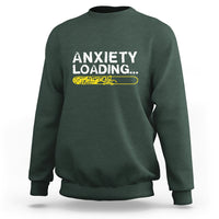 Dark forest green crewneck sweatshirt with 'ANXIETY LOADING...' graphic on the chest