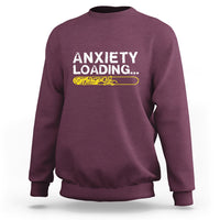 Maroon crewneck sweatshirt with 'ANXIETY LOADING...' graphic on the chest