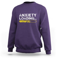 Purple crewneck sweatshirt with 'ANXIETY LOADING...' graphic on the chest