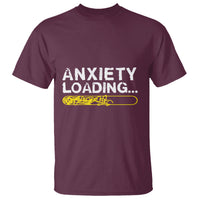 Maroon T-shirt with “ANXIETY LOADING...” text and yellow loading bar graphic