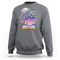 Gray crewneck sweatshirt with colorful book graphic and open book print