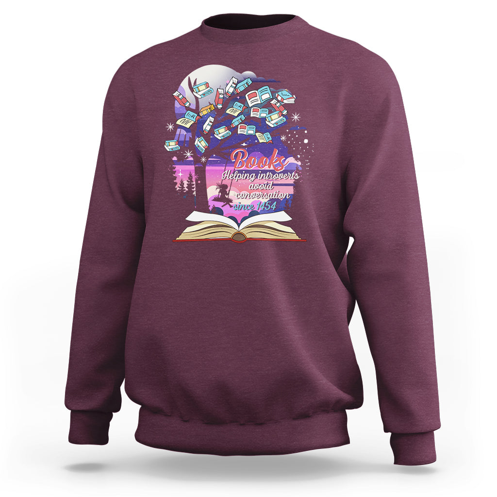 Maroon crewneck sweatshirt with colorful book graphic and open book print