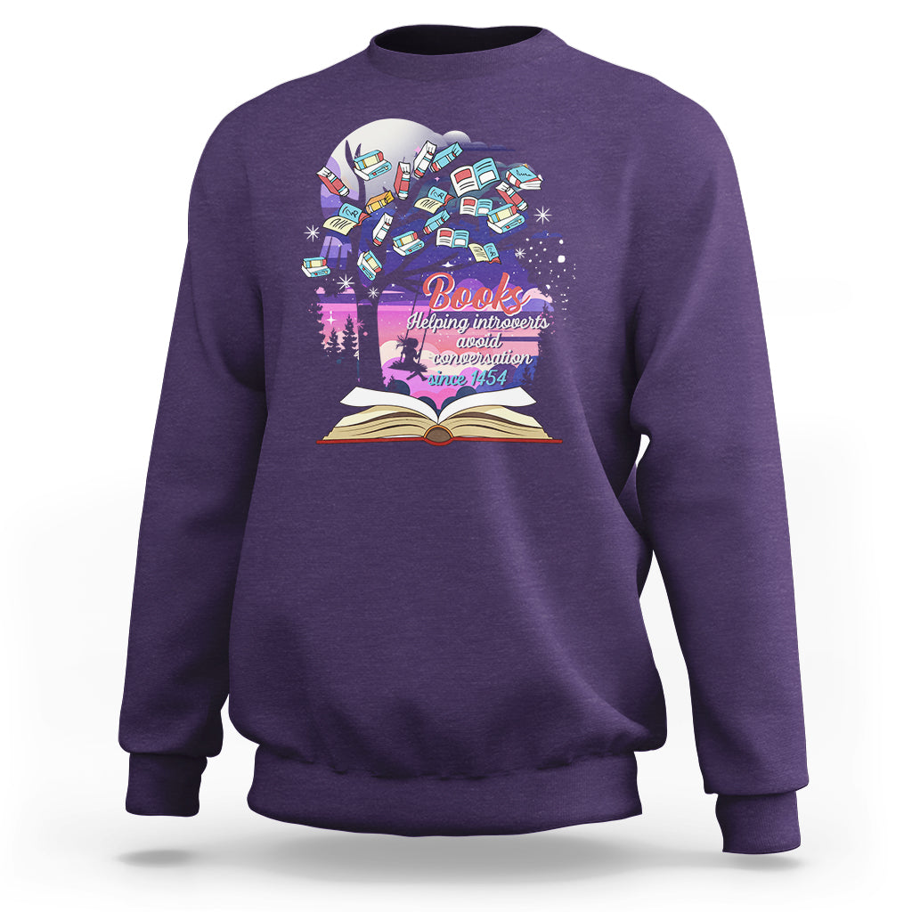 Purple crewneck sweatshirt with colorful book graphic and open book print