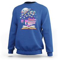 Royal blue crewneck sweatshirt with colorful book graphic and open book print