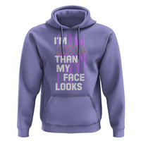 Lavender pullover hoodie with “I'M NICER THAN MY FACE LOOKS” front graphic