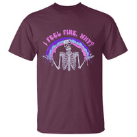 Maroon graphic T-shirt with skeleton under purple rainbow and “I Feel Fine” text
