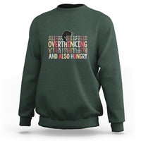 Dark green crewneck sweatshirt with cute cat and “Overthinking And Also Hungry” graphic